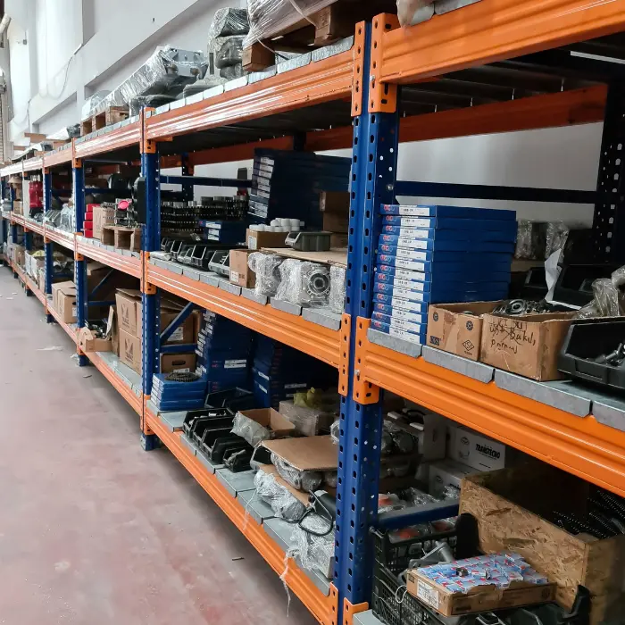 Warehouse shelves stocked with genuine auto parts